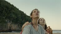 Old – L-R: Prisca (Vicky Krieps), Maddox Aged 16 (Thomasin McKenzie)