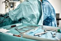 Abgründe - Unfassbare Verbrechen – Close-up of surgical equipment in tray on table against surgeons at operating room