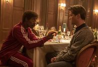Black Monday – L-R: Mo Monroe (Don Cheadle), Blair Pfaff (Andrew Rannells)