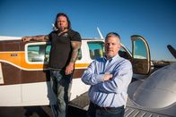 Airplane Repo - Die Inkasso-Piloten – L-R: Danny Thompson and Ken Cage outside an airplane.