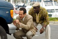 Monk – L-R: Adrian Monk (Tony Shalhoub), Samuel Waingaya (Adewale Akinnuoye-Agbaje )