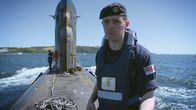 Submarine – Marine is standing on a submarine