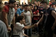 Stronger – holding a wheelchair: Big D (Nate Richman), sitting: Jeff Bauman (Jake Gyllenhaal)