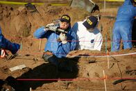 Mayday - Alarm im Cockpit – REENACTMENT - NTSB Investigator (played by Byron Abalos) examines a piece of wreckage discovered at the site of world famous golfer Payne Stewart's fatal plane crash.