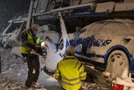 Ice Road Rescue - Extremrettung in Norwegen – FINNSNES, Norway - Camera operator Magnus Wiig filming Frank Sebulonsen, as he prepares to rescue a truck transporting nine cars. (Photo Credit: National Geographic Channels)
