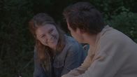 Tödliche Stille – A boy and girl sitting around a campfire.