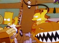 Die Simpsons – Bart (li.) will das Seifenkistenderby gewinnen, aber gegen seinen schärfsten Konkurrenten Nelson hat er einen schweren Stand.
