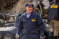 Mayday - Alarm im Cockpit – REENACTMENT - The Lead NTSB Investigator (played by Brendan Wall) surveys the wreckage at the crash site of Execuflight 1526. (Cineflix 2020/Darren Goldstein)