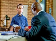 Young Sheldon – L-R: Sheldon Cooper (Iain Armitage), Professor Boucher (Lance Reddick).