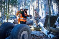 Mayday - Alarm im Cockpit – Investigator Bob Benzon (played by Kevin Carter) and recovery workers (played by background actors) recover the black boxes from Alitalia flight 404.