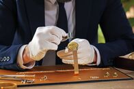 Deal Makers - Alles hat seinen Preis – Appraiser with loupe evaluating luxury wristwatch at table indoors, closeup