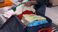 Airport Security: Brazil – São Paulo, Brazil - Hallazgo sospechoso. Police find suspicious containers in a passenger's bag.