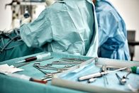 Abgründe - Unfassbare Verbrechen – Close-up of surgical equipment in tray on table against surgeons at operating room