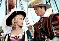 Die Küste der Piraten – Luis Monterey (Lex Barker), noch Kapitän eines spanischen Kriegsschiffes, ist in Isabella (Estella Blain), die Nichte des Gouverneurs von Hispañola, verliebt.
