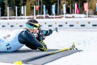 Biathlon: Weltcup – Biathlete shooting with a rifle at a shooting range at a race