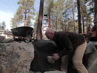 Die Teichbauer – Ed Beaulieu placing stones at the Strittmatter build in Wrightwood, CA. The guys have mapped out a massive 30-foot stream, made up of cascading waterfalls and spawning pools, emptying into a large base pond.