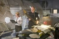 Mayday - Alarm im Cockpit – RE-ENACTMENT - Bouillard (played by Stuart Clow) holds up a properllor blade as another investigator (played by a background preformer) takes notes.