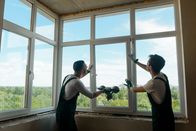 Marktcheck – Men are installing a window.