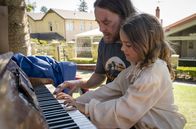 Upright – l-r:Billie Flynn (Asmara Feik), Lucky Flynn (Tim Minchin)