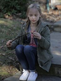 Evil - Gesichter des Bösen – Child Robin playing by herself with a wooden stick.