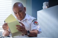 Mayday - Alarm im Cockpit – KNKT Investigator Ray Nurcahyo (played by Von Flores) reviews his notes concerning downed Trigana Air Service Flight 267. (Cineflix 2018/Darren Goldstein)