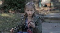 Evil - Gesichter des Bösen – Child Robin playing by herself with a wooden stick.