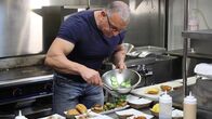 Restaurant Impossible – Host Robert Irvine shows them a recipe for sliders, as seen on Food Network's Restaurant: Impossible, Season 13.