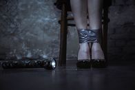 F.B.I. - Dem Verbrechen auf der Spur – Chained up. Protectless scared tender lady sitting on a chair while her ankles being tied up and a flashlight lying beside her
