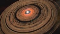 Das Universum - Eine Reise durch Raum und Zeit – Während ein Stern entsteht, nimmt er große Materiemengen aus der ihn umgebenden Gas- und Staubscheibe – der Akkretionsscheibe - auf.