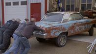Rust Valley Restorers – Rick, Dave, Greg and Tony pushing Fairlane into garage.