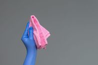 Das blaue Wunder – Hand in a rubber glove holds a bright microfiber duster