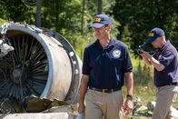 Mayday - Alarm im Cockpit – REENACTMENT - NTSB Investigator Joe Sedor (played by Jason Faulkner) walks through the crash site of Comair Flight 5191, while a NTSB Crash Investigator photographs the wreckage. (Cineflix 2020/Darren Goldstein)