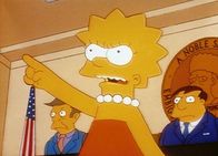 Die Simpsons – Lisa erklärt vor dem Stadtrat, dass Jebediah Springfield gar kein großer Held war, wie alle glauben.