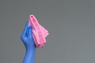 Das blaue Wunder – Hand in a rubber glove holds a bright microfiber duster