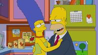 Die Simpsons – Marge (l.); Homer (r.)