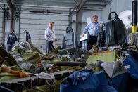 Mayday - Alarm im Cockpit – TSB Investigators Mike Cunningham (played by Judah Katz) and Alan Chaulk (played by Glen McDonald) comb through and inspect the remains of the passenger cabin from Cougar Helicopters Flight 91. (Darren Goldstein/Cineflix 2019)
