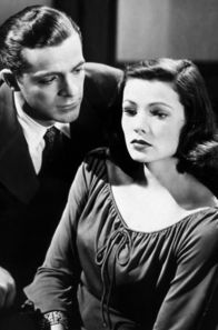 Laura – Polizist Mark McPherson (Dana Andrews) verhört die erfolgreiche Geschäftsfrau Laura Hunt (Gene Tierney).