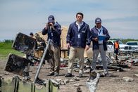 Mayday - Alarm im Cockpit – JIAAC Investigator Augusto De Santis (played by John Philip Vazquez) and the rest of the investigators stand at the crash site of SOL Lineas Aerias Flight 5428. (Cineflix 2019/Darren Goldstein)